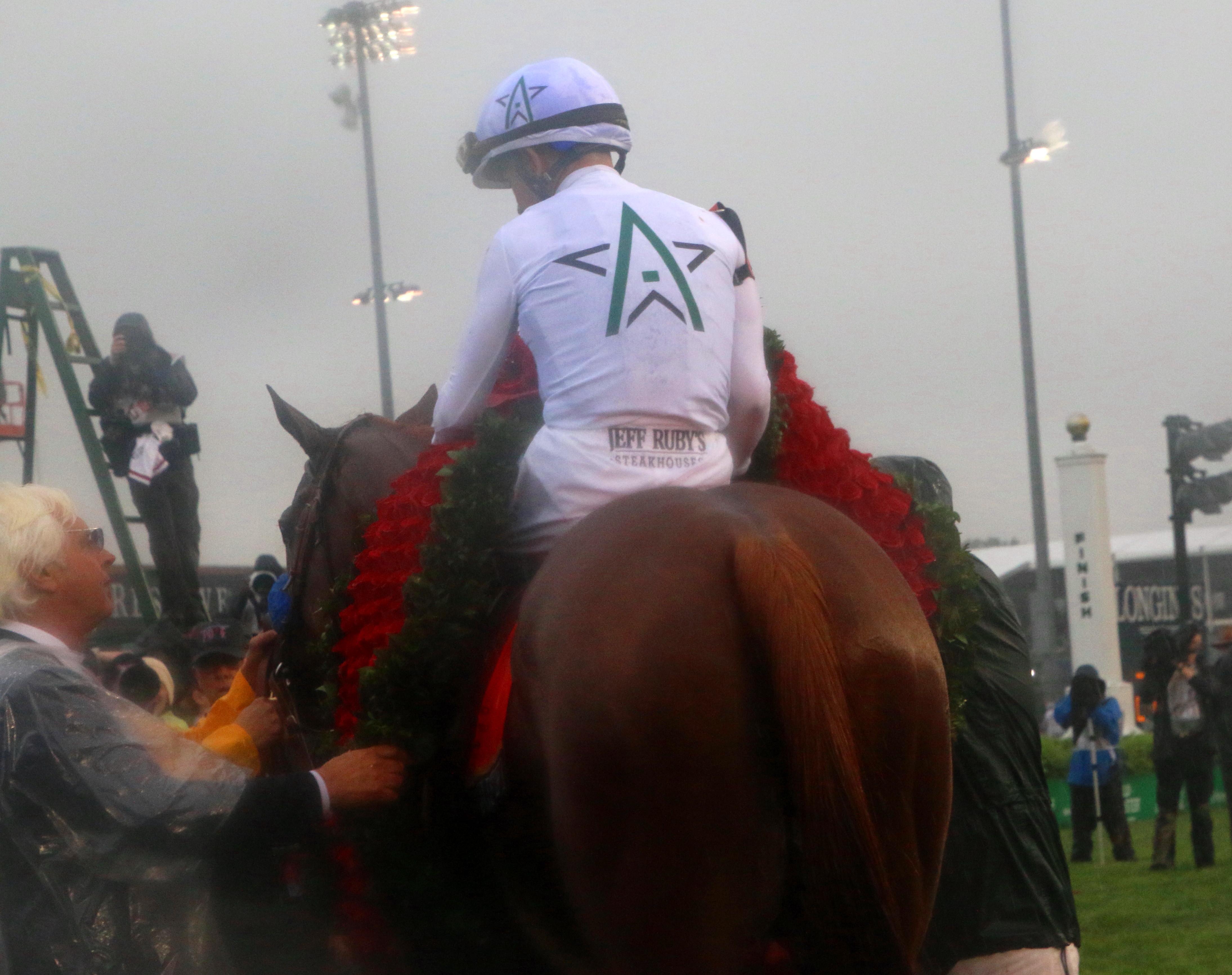 Justify wears the Derby roses.